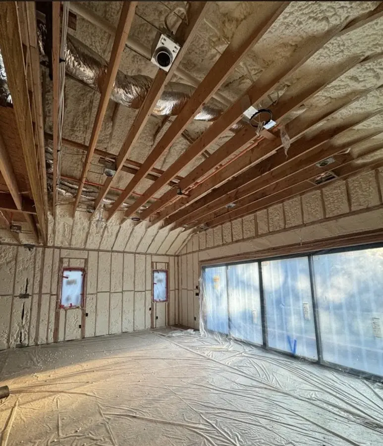 Interior walls and ceiling insulated with spray foam during new construction in Bentonville